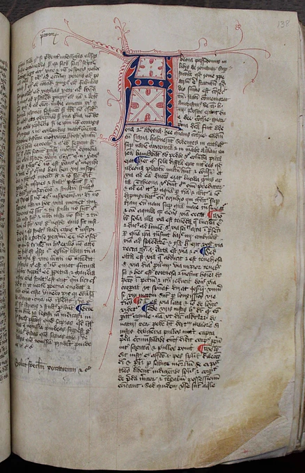 The text is divided into two columns. At the top of the right hand column is a large letter A in a red and blue zig-zag pattern with red ink flourishes extending off it in the margins and down between the columns of text. 