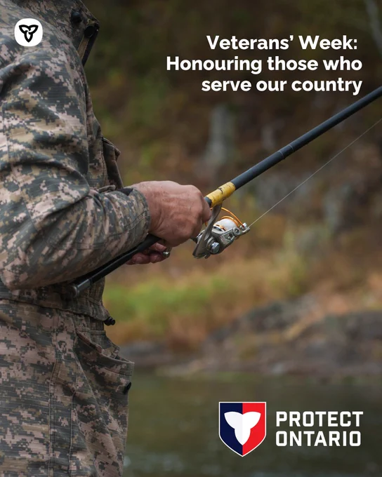 Individual in camouflage jacket and pants fishing in a river. Text reads, “Veterans’ Week: Honouring those who serve our country”