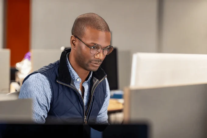 Professional working at a desk in a modern office environment