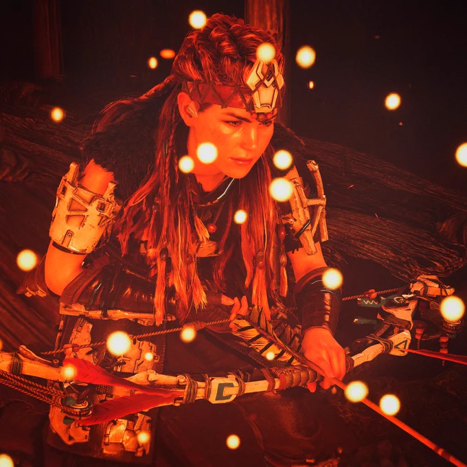 Aloy is crouching with her bow in her hands. Horizon Zero Dawn Remastered.