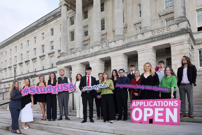 Economy Minister pictured with former Study USA students at Parliament Buildings, Stormont