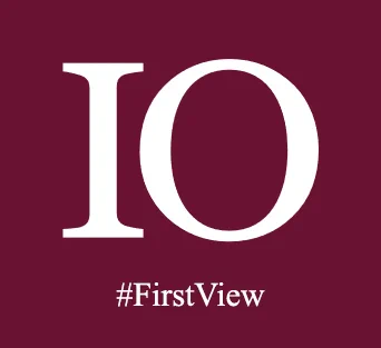 Logo featuring the letters "IO" in large white font on a burgundy background, with the hashtag "#FirstView" below in smaller font.