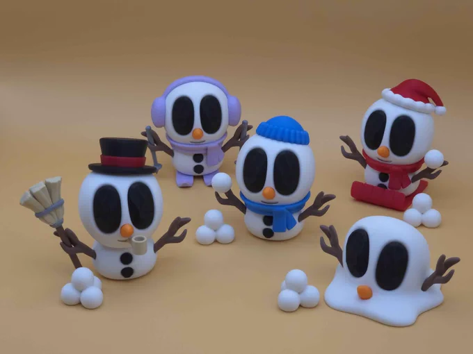 A lineup of five cute 3D-printed snowman creatures called Snowblobs. Each has black oval eyes, stick arms, and winter accessories — one with a top hat and pipe, one in earmuffs with ski poles, one with a blue beanie and scarf, one in a red Santa hat, and one melting into a snow puddle. Snowballs are scattered around them against a warm tan background.