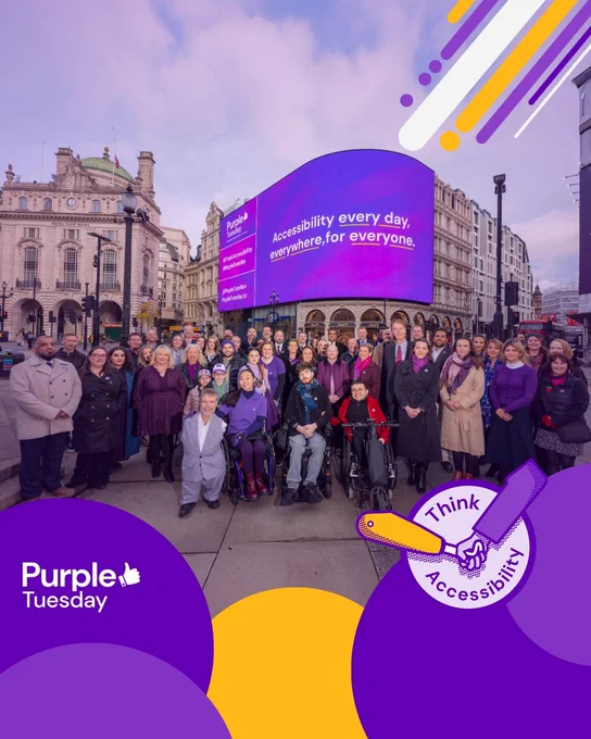 The Purple Tuesday Team and partners attending the production at the Piccadilly Lights. The large group, including Purple Tuesday sponsors, the Purple Tuesday team, Lee Keogh, Alex Vasquez, Ayuna Berbidaeva, Victoria Jenkins, Tom Ryan-Elliott, Sebastian Fontenelle, Kris Foster, and Amy Riddett, are outside. Several individuals use wheelchairs, and Mike, who has short legs and no arms, is in the center. The billboard displays: "Accessibility every day, everywhere, for everyone."
