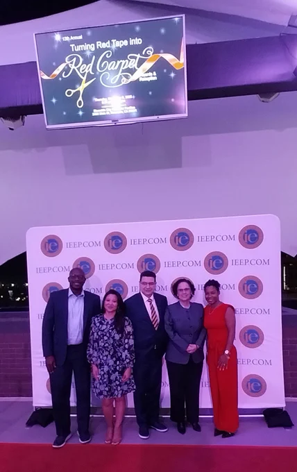 UC Riverside team in front of the event backdrop.