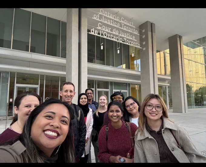 Tour members in front of courthouse