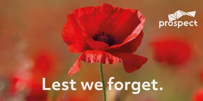 Photo of a poppy with text “Lest We Forget.”