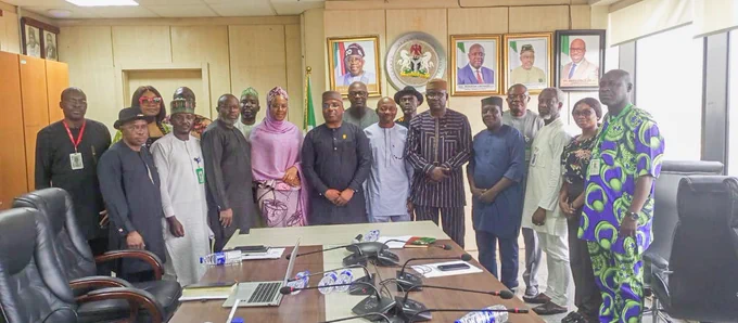 The Permanent Secretary MPR. Dr. Vitalis Emeka Obi mni (5th left) in a group photograph with the Chairman and members of the Technical Committee on creation of the Nigeria Green Fund and Development of Sovereign Carbon Credits in Abuja.