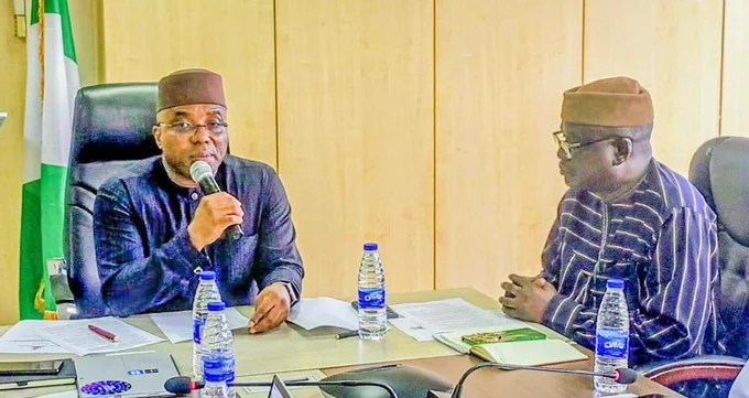 The Permanent Secretary MPR, Dr. Vitalis Emeka Obi mni (left), the Chairman of the Technical  Committee on creation of the Nigeria  Green Fund and Development of Sovereign Carbon Credit Mr. Mohammed Mohammed Abubakar (right) during the inauguration ceremony in Abuja.
