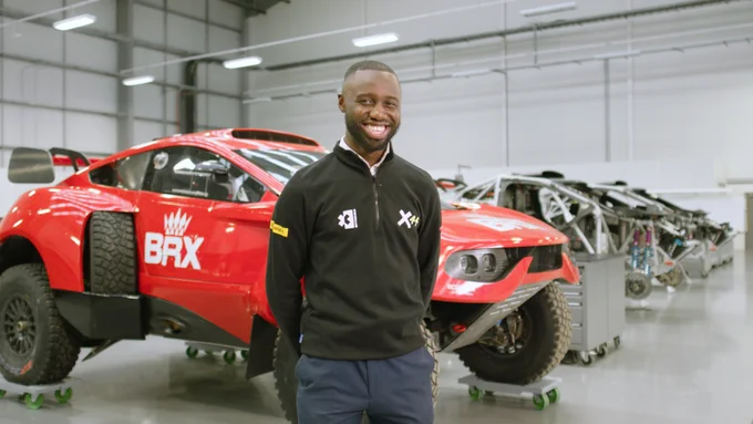 Male mechanical engineer designs electric vehicles.