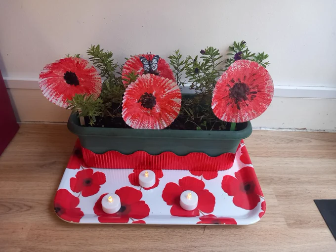 Paper remembrance poppies in a plant pot