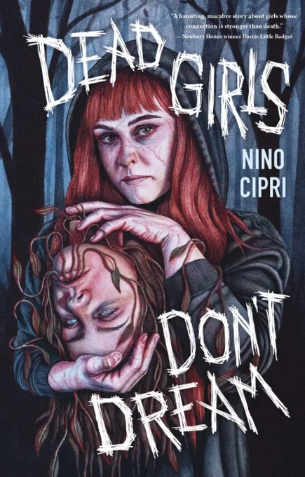 Book cover for "Dead Girls Don't Dream" by Nino Cipri. A girl with red hair in a black hoodie and holds the head of another girl who's hair is vibes coming from her mouth. Behind her is a dark forest.