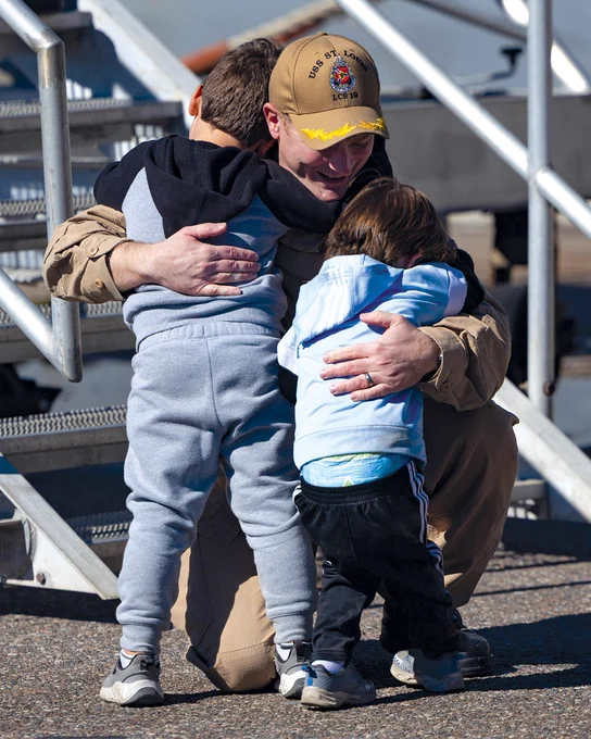 A Sailor assigned to the Freedom-variant littoral combat ship USS St. Louis, operating under U.S. Northern Command, greets his family members as the ship returns to Naval Station Mayport, Florida after completing a deployment, Nov. 10, 2025.