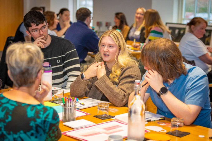 People discussing around a table