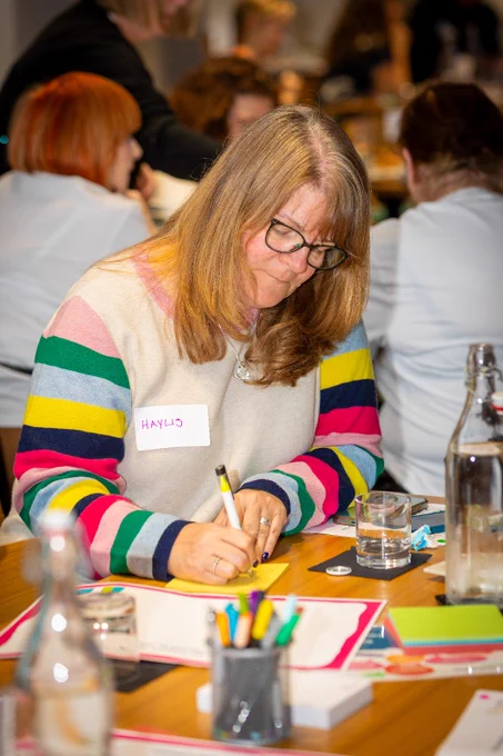 A lady writing a note