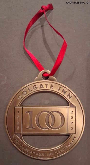 A commemorative ornament celebrates the 100th anniversary of the Colgate Inn in Hamilton, New York.  Its inscription reads, “Colgate Inn 100, 1925-2025, A Century of Genuine Hospitality.”  (Andy Bass photo, 2025)