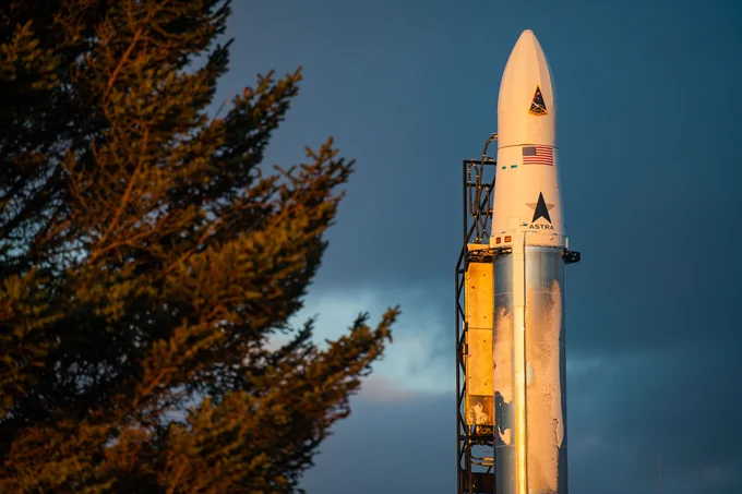 Astra rocket with tree branches in foreground