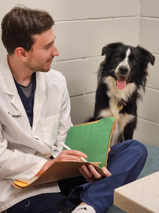 An image of JustFoodForDogs board-certified veterinary nutritionist Dr. Chris Margrey, with his own dog Mowgli.