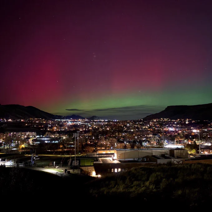 A wide view of northern Golden and Marv Kay Stadium under the aurora borealis