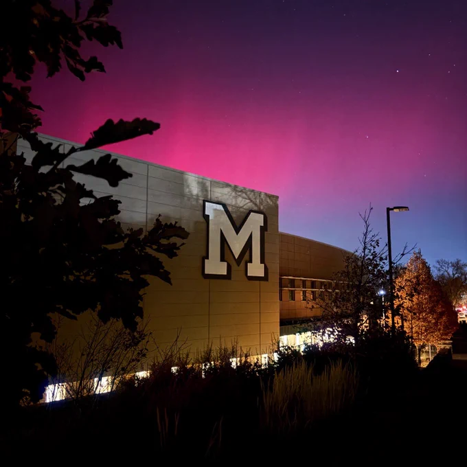 The exterior of Marv Kay Stadium with the aurora borealis behind it