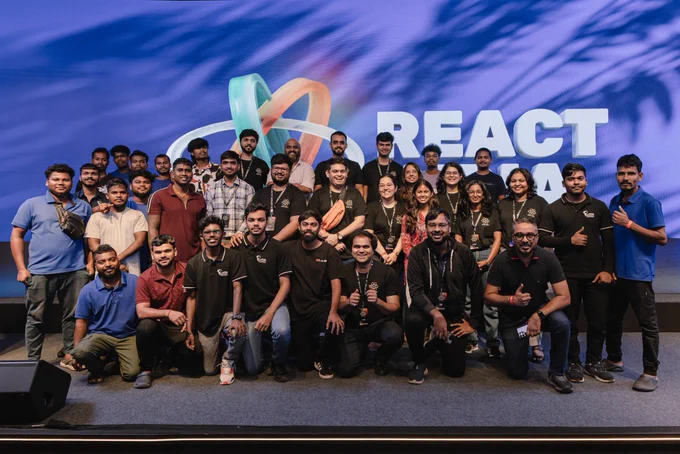 Group picture of production and volunteer teams at react India