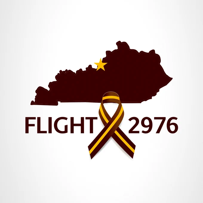 Silhouette of Kentucky with a yellow star, over "FLIGHT 2976" and a brown and yellow striped ribbon.