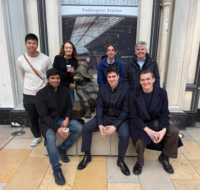 The Locai Labs team posing by the Paddington Bear statue at Paddington Station to celebrate Locai's Early Access launch
