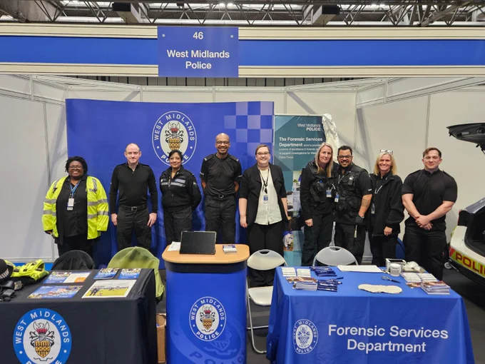 The Outreach team and the Forensics team standing together