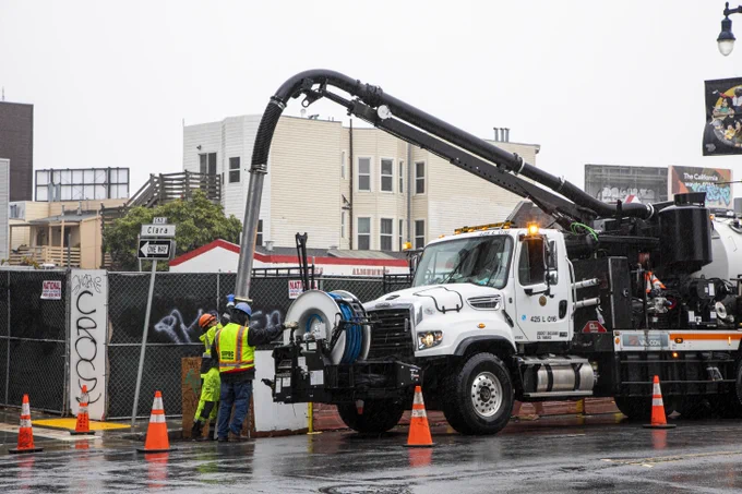 SFPUC crews clearing out a storm drain using the Vac-Con truck.