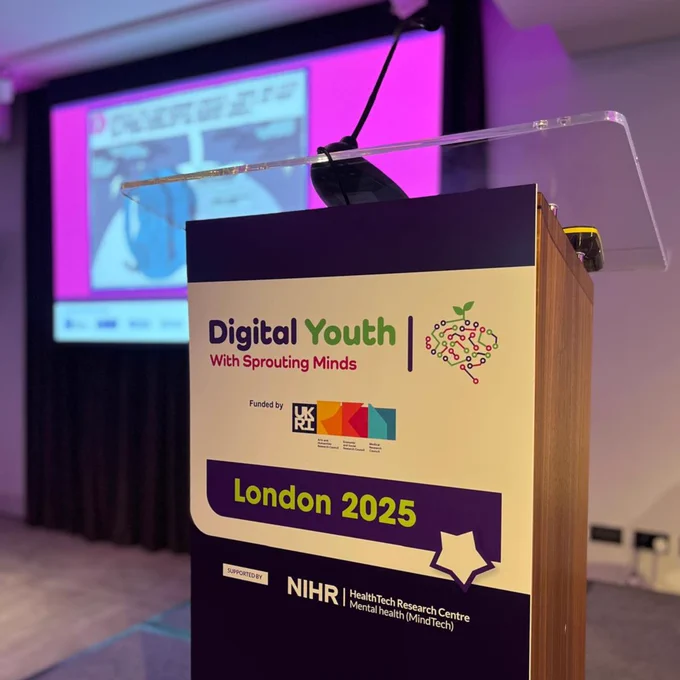 A lectern featuring the text Digital Youth London 2025
