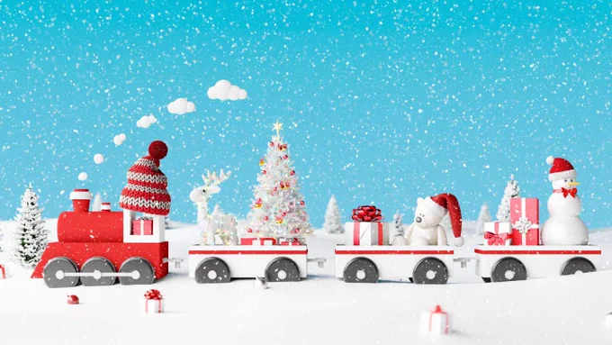 A festive holiday scene displaying a toy train in a snowy landscape. The first cart has a red locomotive adorned with a hat, followed by carts containing a reindeer, a decorated Christmas tree, gifts, and a snowman, all under falling snowflakes.