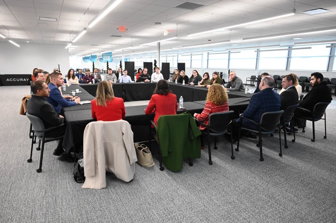 UW–Madison leadership, leaders from Accuray, and Congressional staff participate in a round table discussion