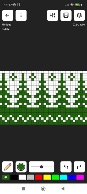 Screenshot d'une application pour faire du pixel art (Pixilart), j'y ai fait un motif de sapins verts sur fond blanc avec des gens de vagues en bas et d'étoiles en haut