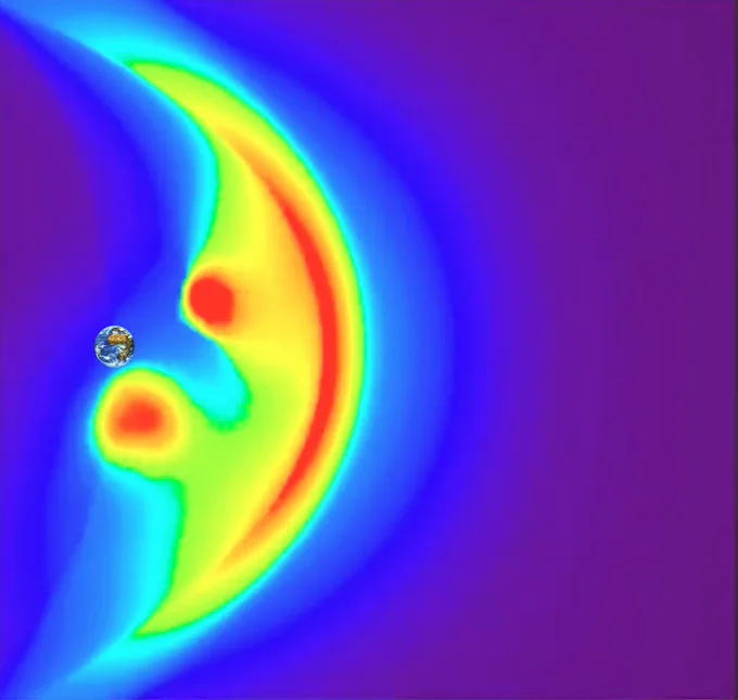 Simulated X-ray emissions from Earth's magnetic field. A small view of planet Earth is surrounded by a rainbow of colours arranged in what appears to be a smiley face, responsible for the mission’s name. The image shows expected X-ray emissions from the front of Earth’s magnetic field. The edge of the magnetic field is visible as a bright red bow shape. Two red spots indicate the magnetic holes around Earth's north and south poles, where particles are let in and form the auroras.