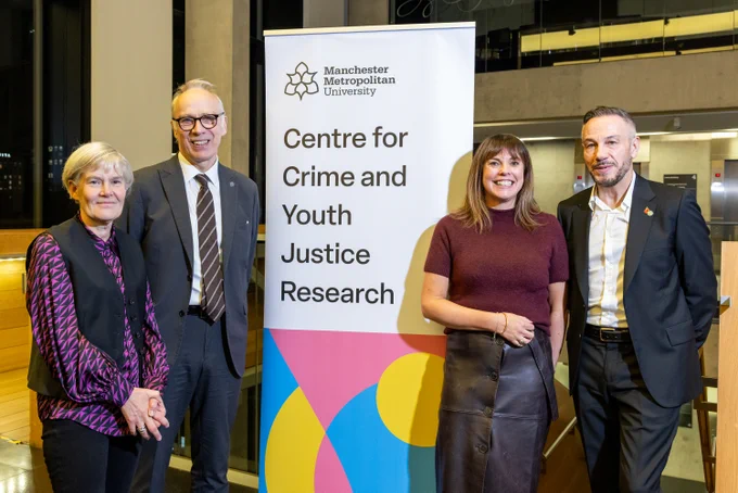 From left to right: Kate Green (Deputy Mayor of Greater Manchester), Professor Nick Brook (Manchester Met), Professor Hannah Smithson (Manchester Met) and Paul Marshall (Manchester City Council). All four individuals are posing for a photo next to a sign which says "Centre for Crime and Youth Justice Research".