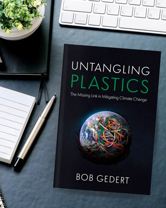 Untangling Plastics by Bob Gedert on a desk with a keyboard, notebook, notepad, and pen.