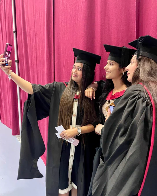 A group of friends take a selfie during the University of Derby graduation ceremony