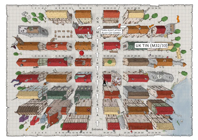 A map to Dragonmeet depicting the stalls as buildings with arrows straight up the middle from the entrance, and labels saying "Turn right after Alley Cat Games" and "UK TIN M32/33".