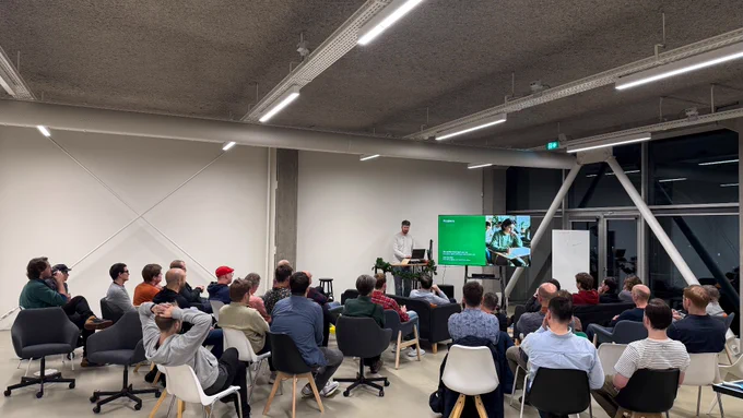 Martin Schilstra presenting his talk in front of an audience. 
