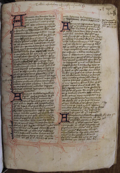 The text is in two columns. Red and blue decorative flourishes run along the left hand sides of both columns. There are four dark blue letter A's - two in each column of text, which also have red flourishes to decorate them.
