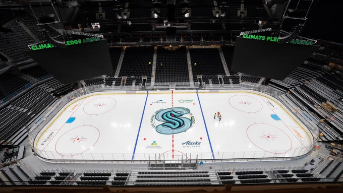 Climate Pledge Arena mock-up of Seattle Torrent Logo wrapping Seattle Kraken Logo from above.