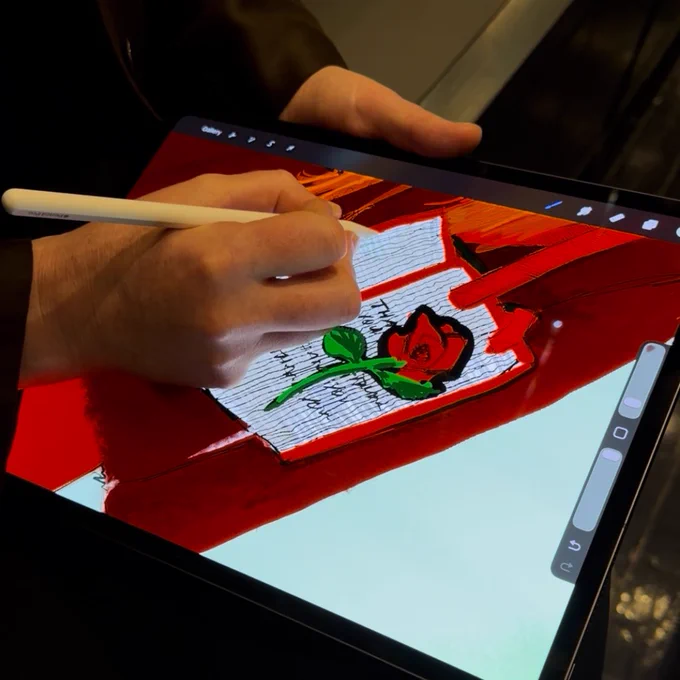 Kat Hoelck, Founding Partner of ANYBAG, sits at the iPad drawing a variation of a new design inspired by New York City's classic bodega bags at the Apple HQ in NYC during their holiday event. Founder Alex Dabagh sat and wove their proprietary textile at the loom. Ancient technology. 