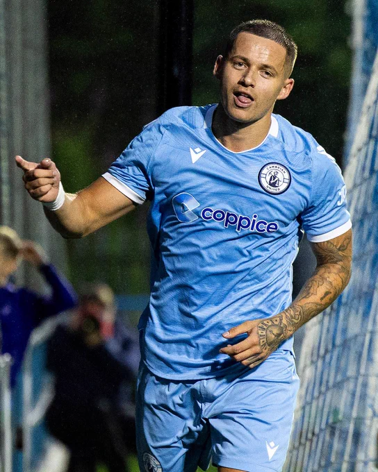 Calum Bateman celebrates scoring for Cambrian United.
