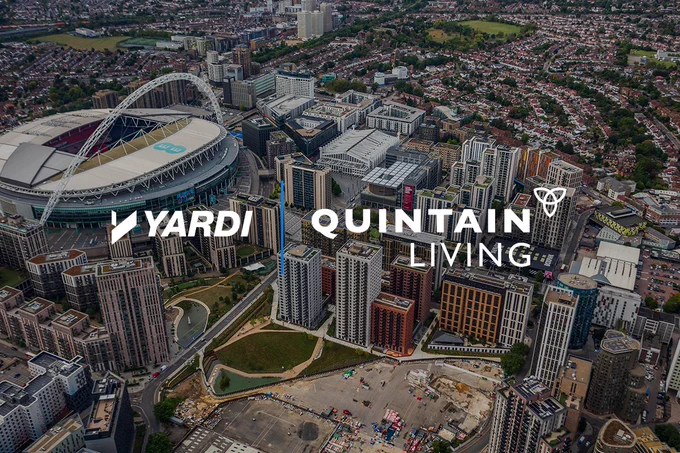 Aerial view of a modern urban development with the logos of Yardi and Quintain Living superimposed on the image. Wembley Stadium is visible to the left.