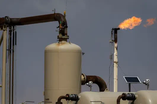 Flares burn off excess natural gas at the Endeavor Energy Resources LP oil and gas wells near Tarzan, Texas, on March 15, 2025.  Photographer: Justin Hamel/Bloomberg
