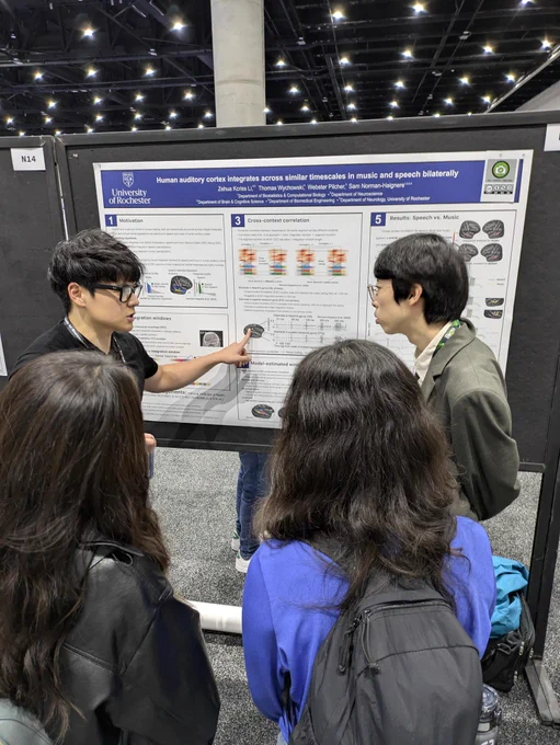 Person presenting research poster