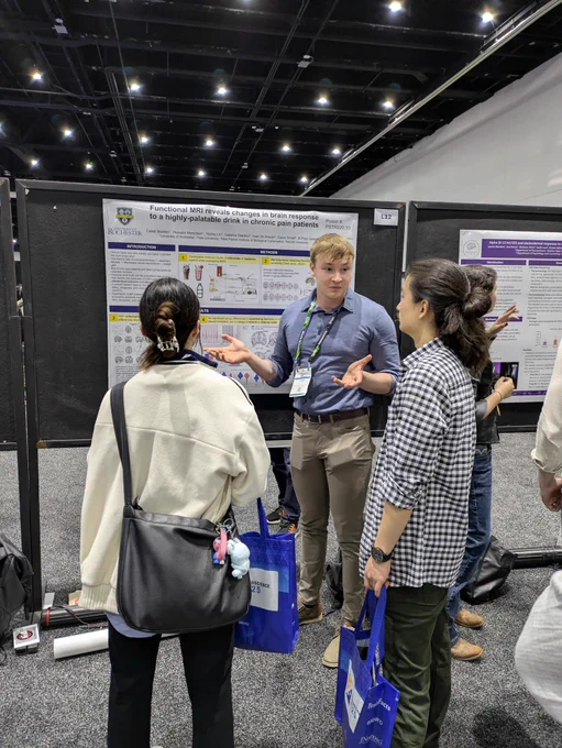 Person presenting research poster