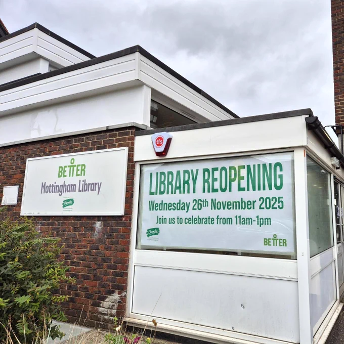 Exterior of Mottingham Library with reopening banner in the window.