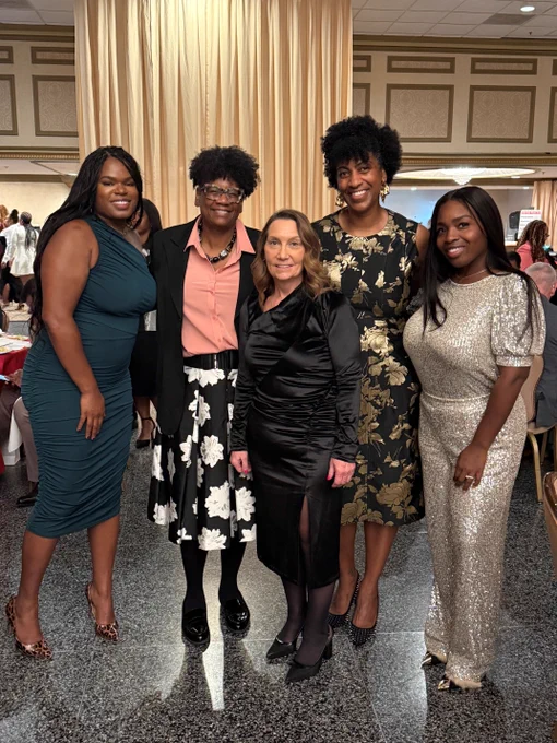 Group of five individuals posing together dressed in  formal attire at the recent Maryland Minority Contractors Association 12th Soirée & Awards Banquet​.  