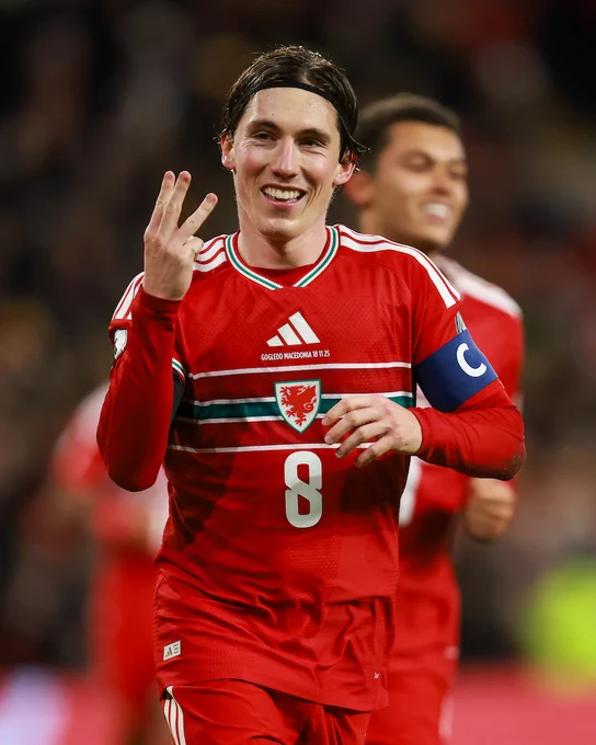 Harry Wilson celebrates scoring a hat-trick for Cymru against North Macedonia. 